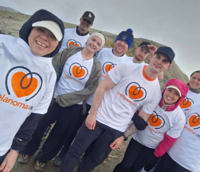 Protecting skin from sun damage during outdoor activities for melanoma awareness.