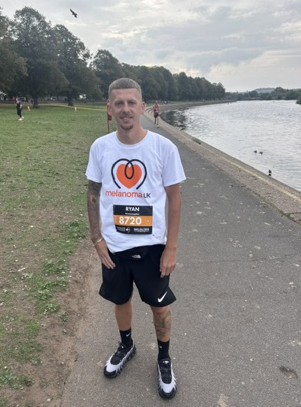 Ryan in running gear after completing Robin Hood Half Marathon by the river.